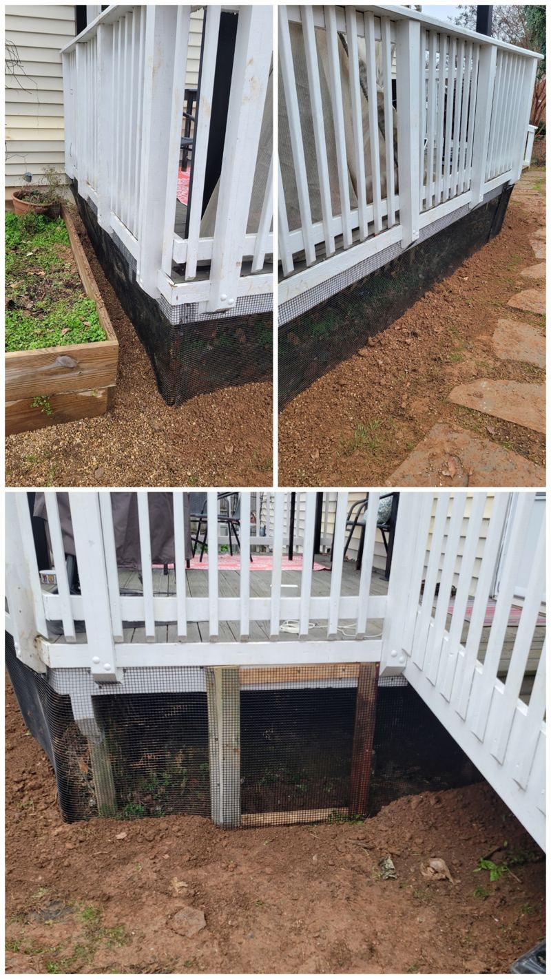 Black steel mesh skirting fitted around a deck and buried at the soil line
